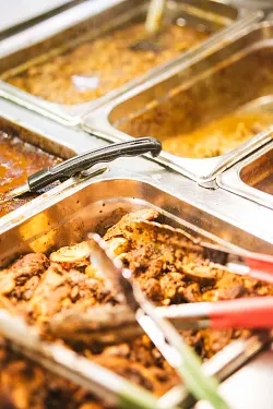 Family-size platter of jerk chicken, oxtail and curry